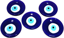 Glass evil eye on string.